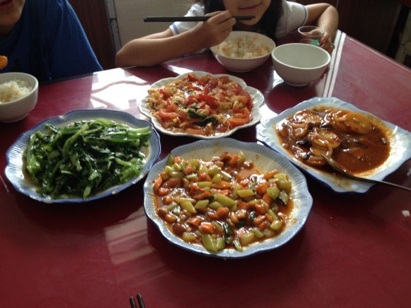 Clockwise from top: Egg & Tomatoes, Sliced braised potatoes, Kung Pao Chicken, Garlic Sauteed Spinach